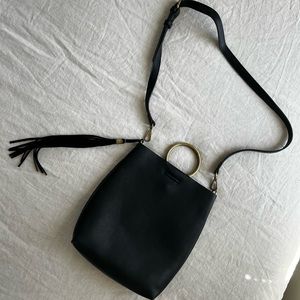 black leather bag with hoop detail